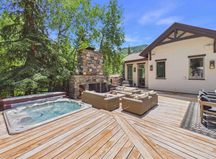 Experience ultimate relaxation in this stunning backyard oasis, featuring a luxurious hot tub perfect for unwinding.