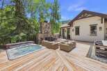 Experience ultimate relaxation in this stunning backyard oasis, featuring a luxurious hot tub perfect for unwinding.