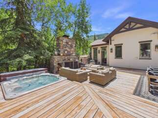 Experience ultimate relaxation in this stunning backyard oasis, featuring a luxurious hot tub perfect for unwinding.