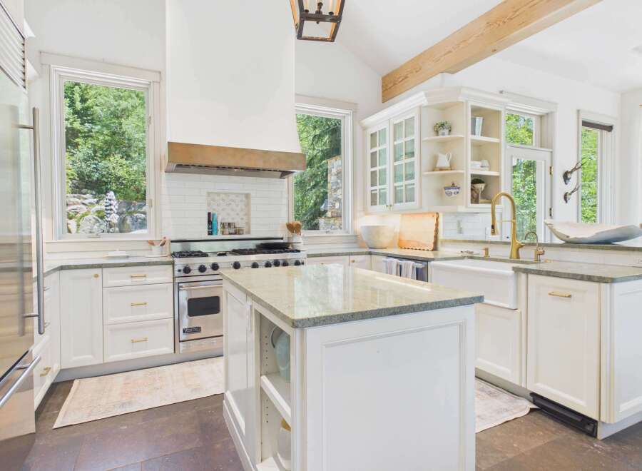 Experience luxury in this stunning gourmet kitchen, featuring a professional-grade Viking range and a spacious island perfect for meal prep and entertaining.