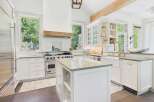 Experience luxury in this stunning gourmet kitchen, featuring a professional-grade Viking range and a spacious island perfect for meal prep and entertaining.