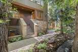 Nestled beside a serene creek and surrounded by lush trees, this property offers a unique blend of modern living and natural beauty.
