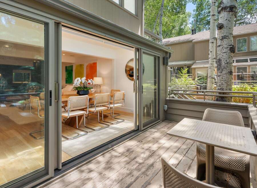 Seamlessly blend indoor and outdoor living with expansive sliding glass doors that open onto a private deck.