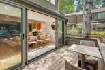 Seamlessly blend indoor and outdoor living with expansive sliding glass doors that open onto a private deck.