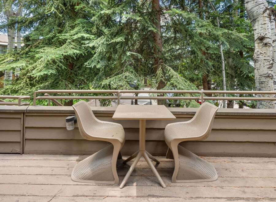 Enjoy your morning coffee or evening drinks on this charming balcony, complete with a stylish table and two chairs.