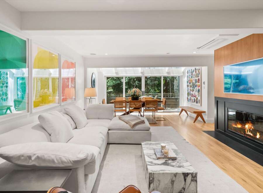 Experience modern living in this spacious open-concept living area, featuring a large sectional sofa perfect for relaxation.