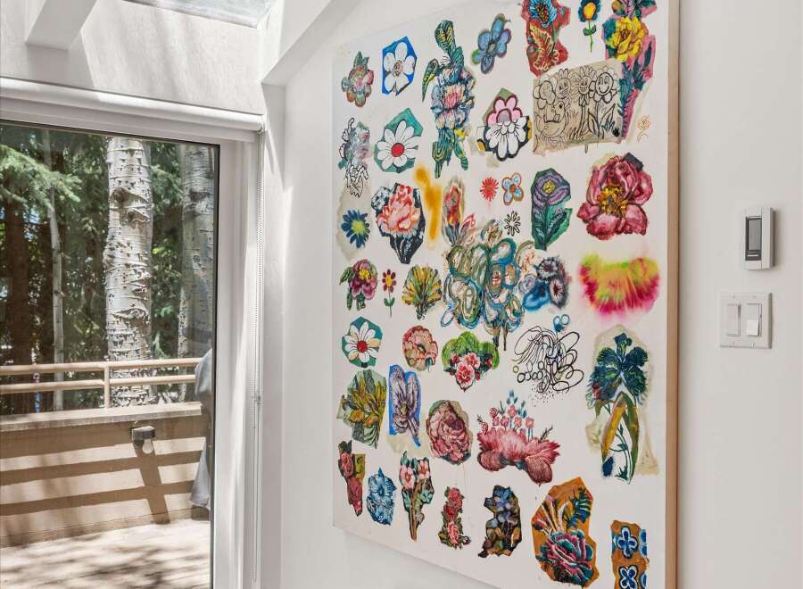 Brighten your entryway with this stunning artwork featuring a collage of vibrant floral designs, adding a pop of color and artistic flair.