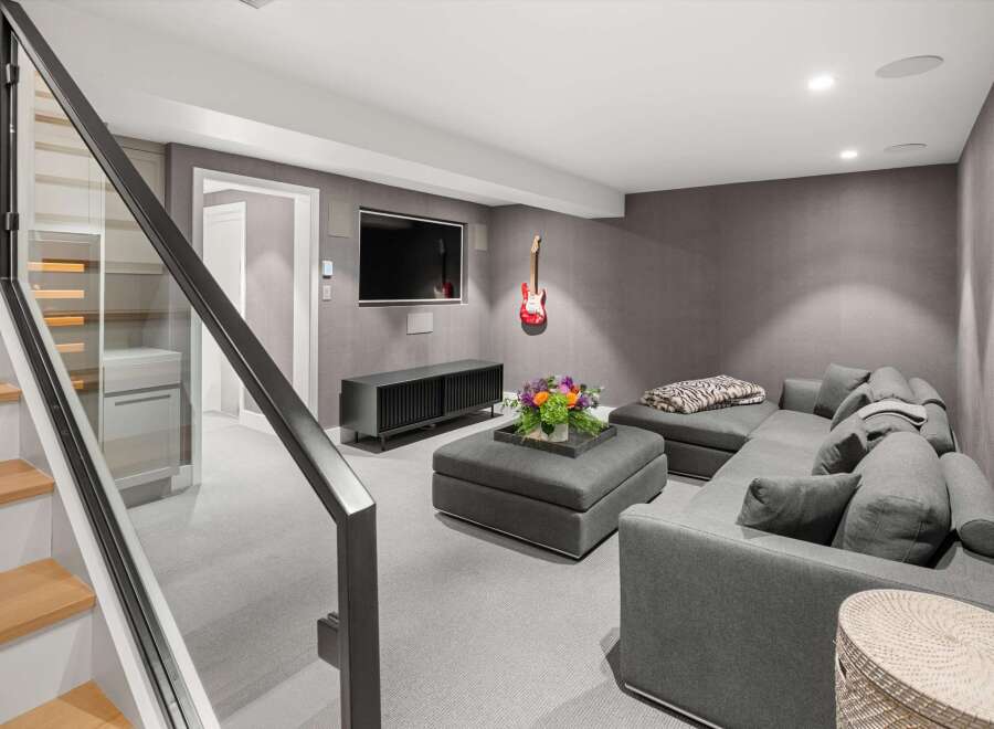 Experience modern comfort in this stylish living space, featuring a plush sectional sofa perfect for relaxation and entertainment.