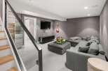Experience modern comfort in this stylish living space, featuring a plush sectional sofa perfect for relaxation and entertainment.