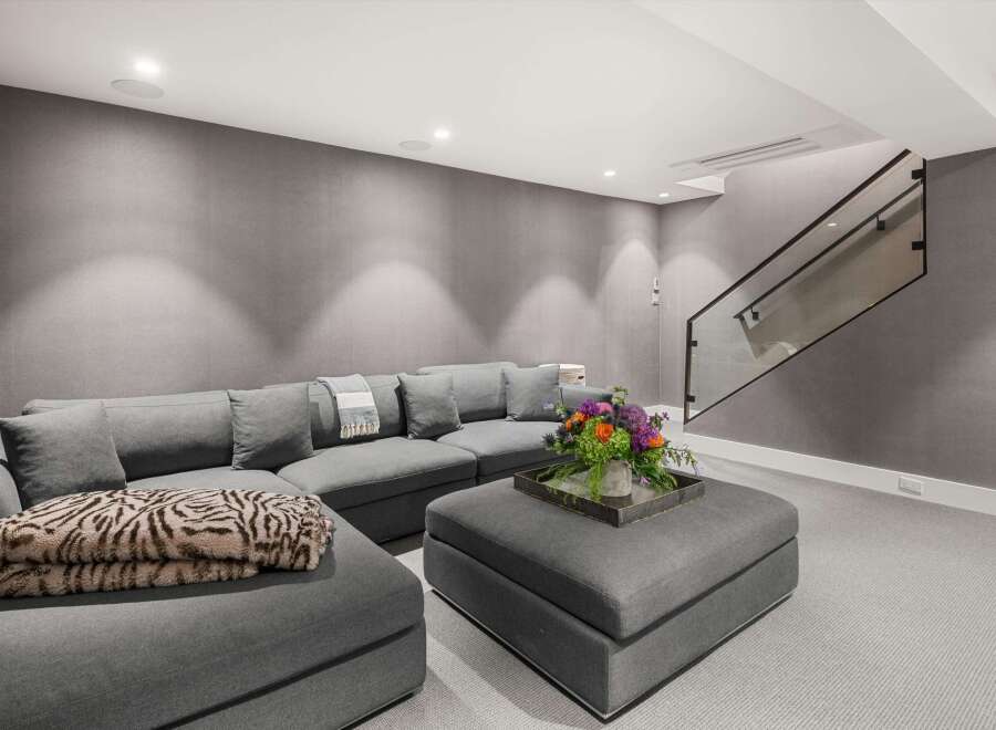 Experience modern comfort in this stylish living space, featuring a plush sectional sofa perfect for relaxation and entertainment.
