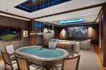Experience ultimate entertainment in this luxurious game room, featuring a professional poker table and a large screen for watching sports or movies.