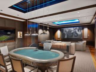 Experience ultimate entertainment in this luxurious game room, featuring a professional poker table and a large screen for watching sports or movies.
