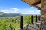 Experience breathtaking mountain vistas from this stunning balcony, perfect for enjoying your morning coffee or evening relaxation.