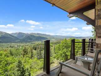 Experience breathtaking mountain vistas from this stunning balcony, perfect for enjoying your morning coffee or evening relaxation.