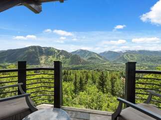 Experience breathtaking mountain views from this stunning property's balcony, perfect for enjoying your morning coffee or evening relaxation.