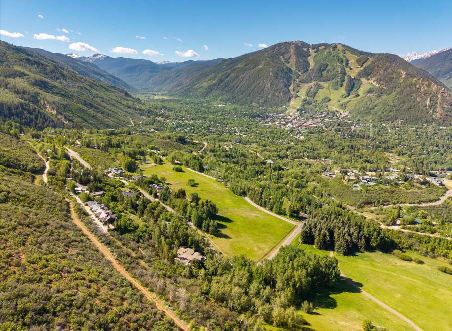 Experience breathtaking mountain views and serene natural beauty from this stunning property, nestled amidst lush greenery and rolling hills.