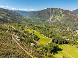 Experience breathtaking mountain views and serene natural beauty from this stunning property, nestled amidst lush greenery and rolling hills.