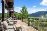Experience breathtaking mountain views from this stunning contemporary home's expansive patio.