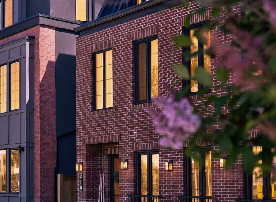 Experience modern luxury in this stunning multi-story residence, featuring a striking brick facade and contemporary architectural design.