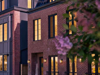 Experience modern luxury in this stunning multi-story residence, featuring a striking brick facade and contemporary architectural design.