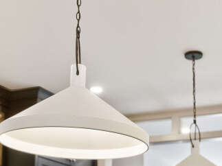 Illuminate your kitchen with these stylish pendant lights, featuring a modern farmhouse design.