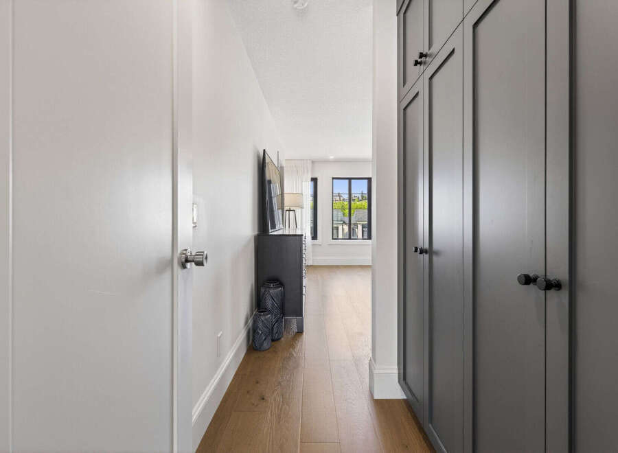 Step into a beautifully designed hallway featuring a sleek, modern aesthetic.
