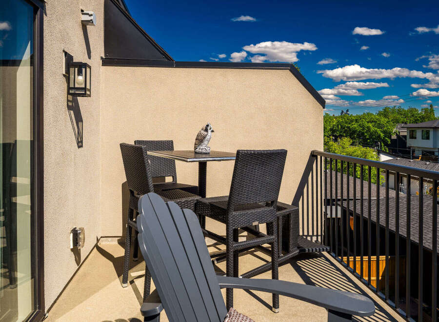 Enjoy your morning coffee or evening drinks on this charming balcony, perfect for outdoor relaxation.