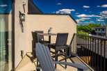 Enjoy your morning coffee or evening drinks on this charming balcony, perfect for outdoor relaxation.