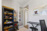Discover a unique space featuring a striking bookshelf filled with decorative items and personal memorabilia.