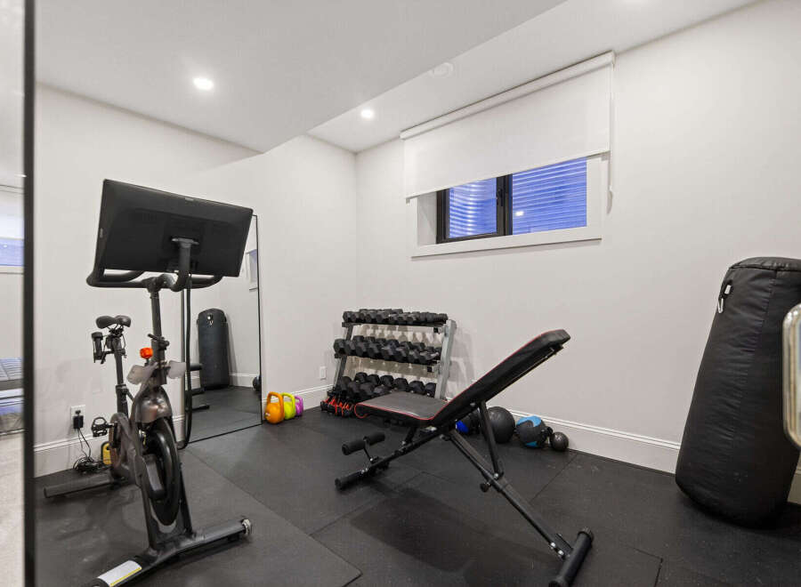 Transform your home into a personal fitness sanctuary with this well-equipped gym.