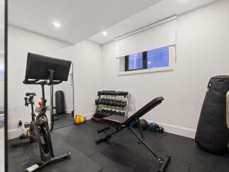 Transform your home into a personal fitness sanctuary with this well-equipped gym.