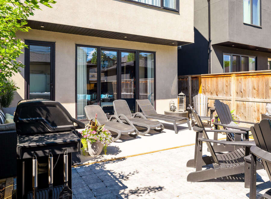 Enjoy outdoor living at its finest with this spacious backyard patio, perfect for entertaining or relaxing.