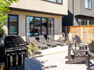 Enjoy outdoor living at its finest with this spacious backyard patio, perfect for entertaining or relaxing.