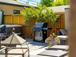 Enjoy outdoor living at its finest with this beautifully appointed backyard oasis.