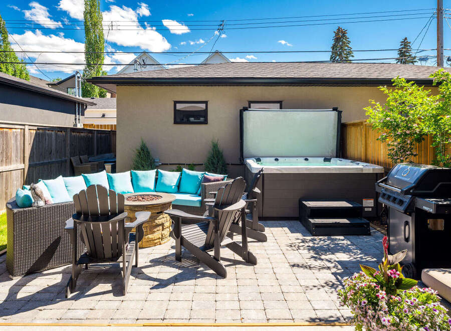 Enjoy ultimate relaxation in this backyard oasis, featuring a luxurious hot tub perfect for unwinding.
