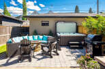 Enjoy ultimate relaxation in this backyard oasis, featuring a luxurious hot tub perfect for unwinding.