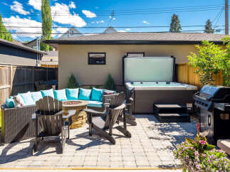 Enjoy ultimate relaxation in this backyard oasis, featuring a luxurious hot tub perfect for unwinding.