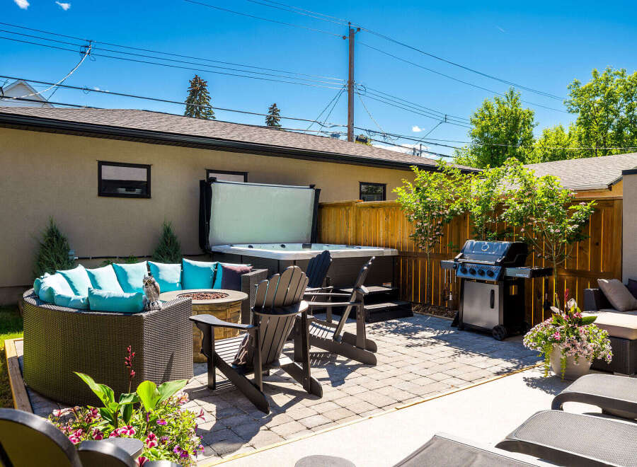 Experience ultimate relaxation in this backyard oasis, featuring a luxurious hot tub perfect for unwinding.