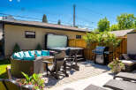 Experience ultimate relaxation in this backyard oasis, featuring a luxurious hot tub perfect for unwinding.