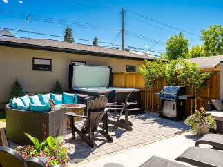 Experience ultimate relaxation in this backyard oasis, featuring a luxurious hot tub perfect for unwinding.