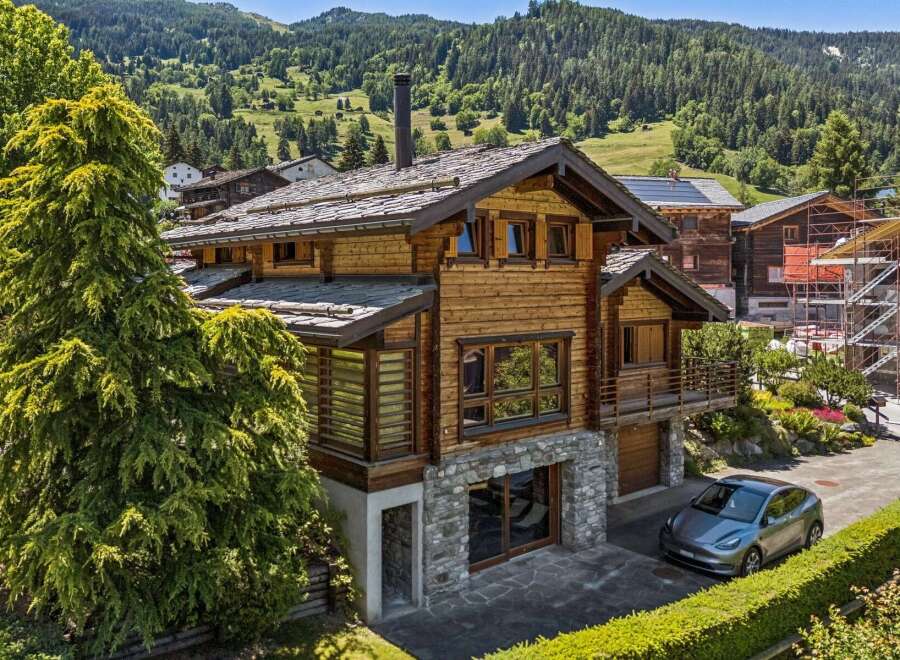 Experience luxury mountain living in this stunning wooden chalet, nestled amidst breathtaking alpine scenery.