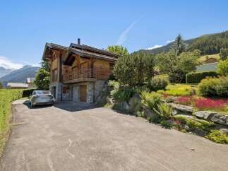 Experience luxury mountain living in this stunning wooden chalet, nestled amidst breathtaking alpine scenery.