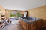 Indulge in relaxation in this luxurious indoor hot tub room, featuring a spacious jacuzzi perfect for unwinding.
