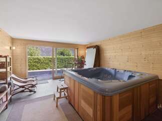 Indulge in relaxation in this luxurious indoor hot tub room, featuring a spacious jacuzzi perfect for unwinding.