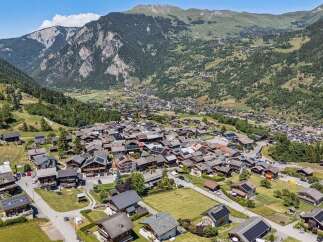 Discover this charming village nestled in a picturesque valley, surrounded by majestic mountains and lush greenery.