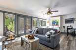 Experience cozy living in this charming studio apartment, featuring a comfortable sofa and a plush bed perfect for relaxation.