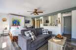 Experience cozy mountain living in this charming studio apartment, featuring a comfortable bed, a modern kitchenette, and a spacious living area perfect for relaxation.