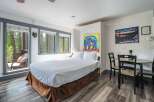 Experience cozy mountain living in this charming studio featuring a comfortable queen-size bed and a convenient dining area.
