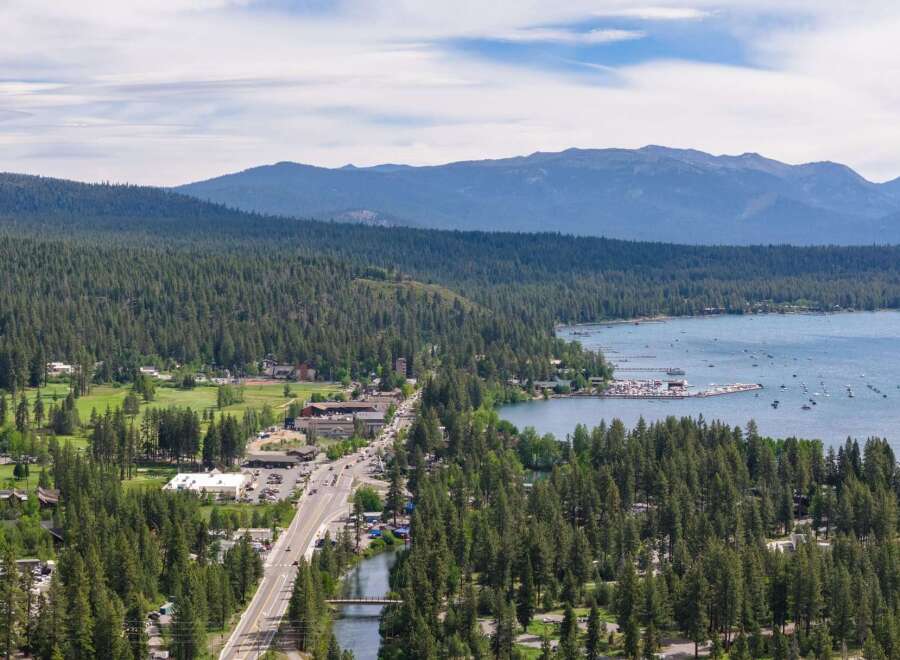 Experience the ultimate lakeside living with this stunning property offering breathtaking views of the serene lake and majestic mountains.