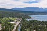 Experience the ultimate lakeside living with this stunning property offering breathtaking views of the serene lake and majestic mountains.